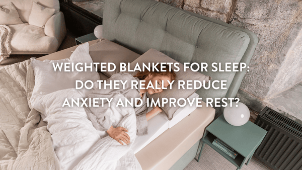 Person sleeping in a bed using a weighted blanket