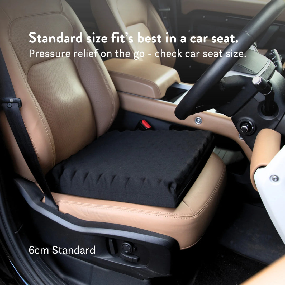 Sero Pressure Cushion Coccyx Cut Out - For car and driving tailbone pain and coccydynia. Discreet stretch cover available in different sizes and thicknesses. Handmade in the UK. 2 year guarantee.
